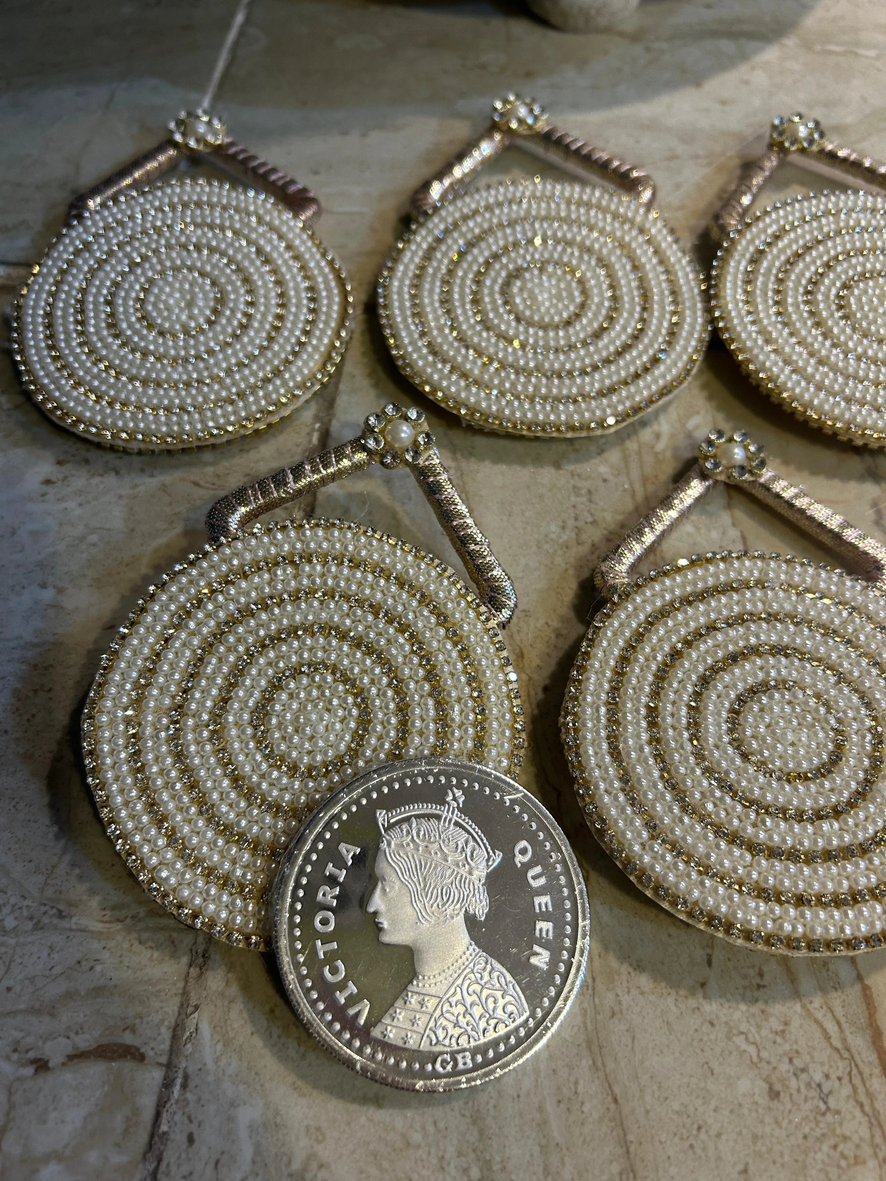 Intricate luxe pearl coin pouch