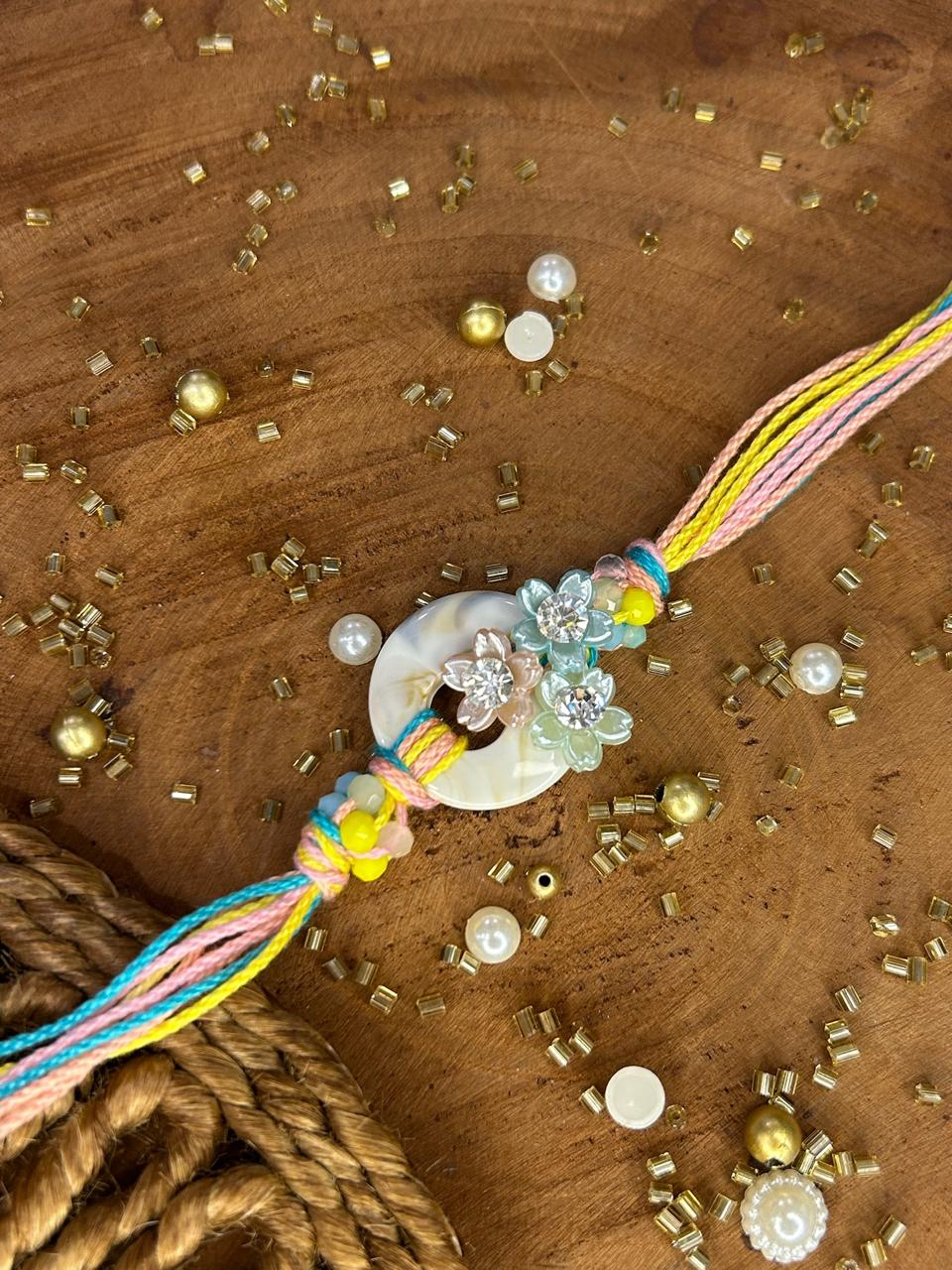 Handcrafted pearl flower Rakhi