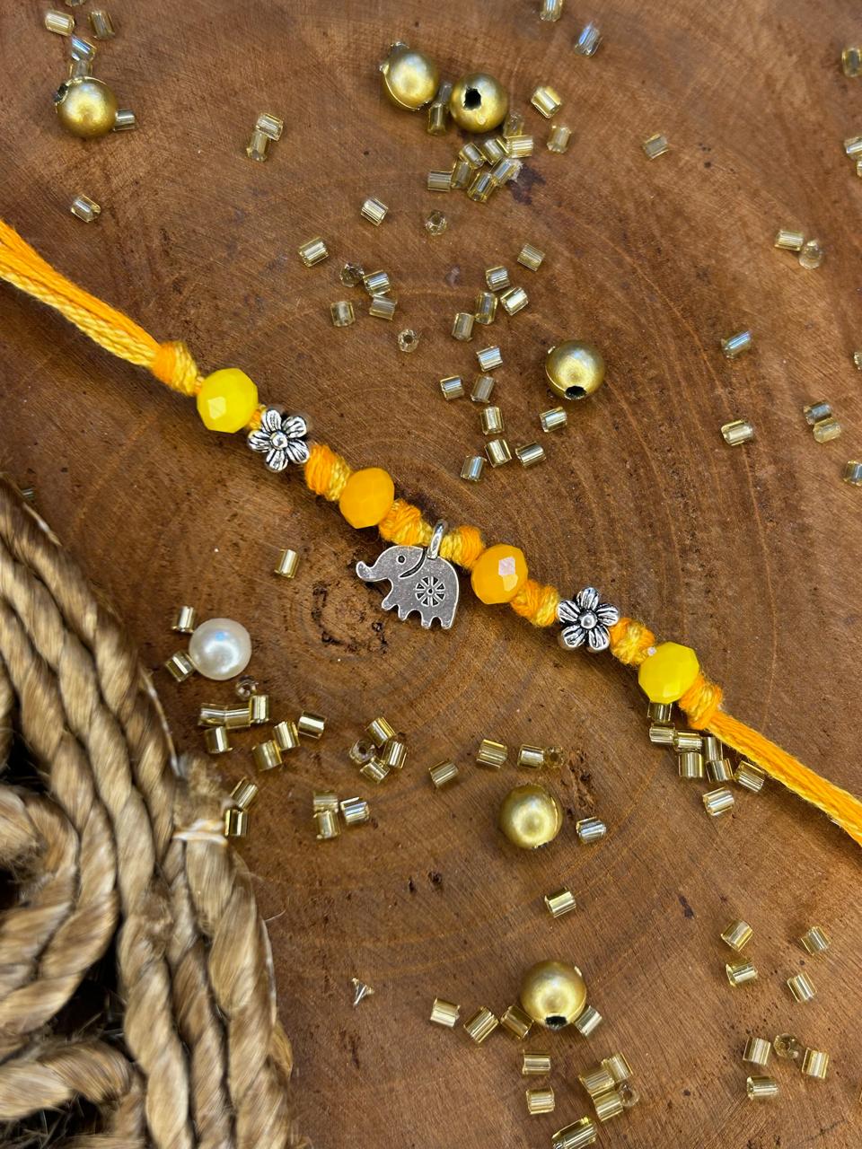 Pure Thread Elephant Rakhi in Yellow