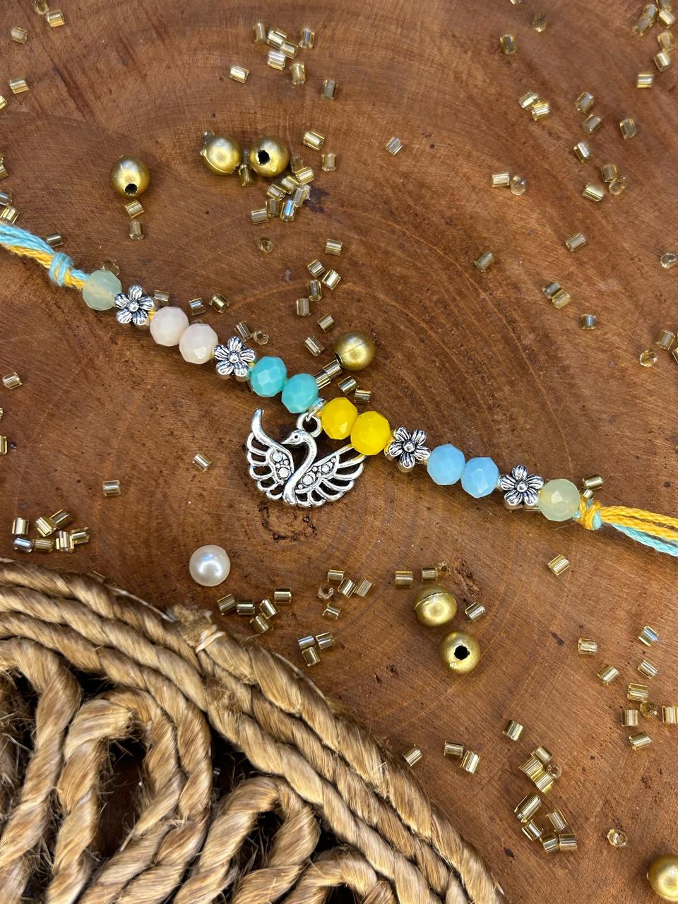 Antique Pearl Peacock Rakhi
