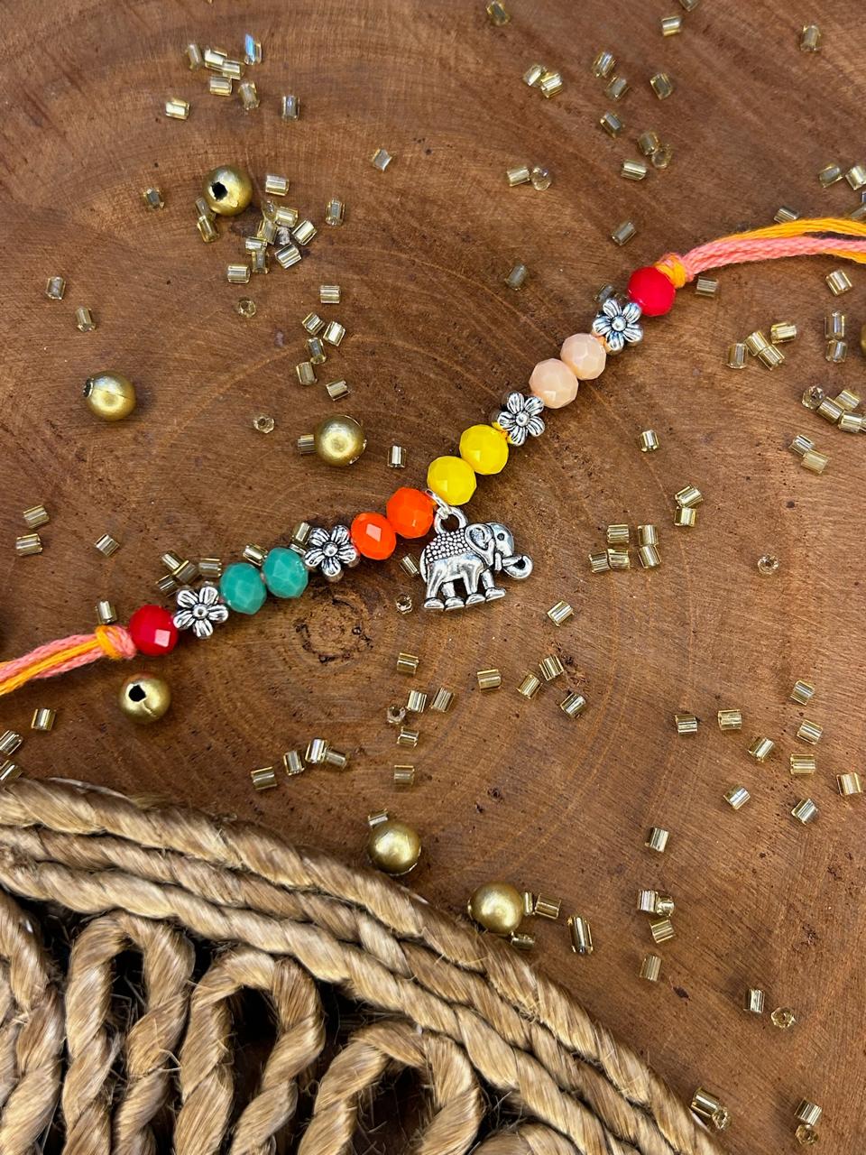 Antique Pearl Elephant Rakhi
